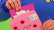 Anthony's hands opening up the envelope