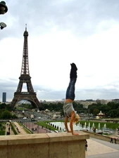 Lauren doing a handstand at the Eiffel Tower