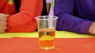 A half glass of apple juice