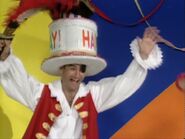 Just then, Captain Feathersword arrives back with the birthday cake underneath his hat.