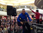 Anthony playing his blue Maton acoustic guitar in Wantirna South, Victoria