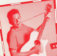 Murray playing Yamaha acoustic guitar in "Let's Wiggle" book