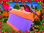 Captain Feathersword holding an empty treasure chest