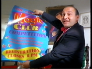 Cecil holding a "Magic Club Competition" poster