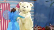 Teddy Bear and Fairy Clare are spinning around in a circle