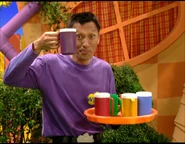 Jeff holding up a cup of hot milk