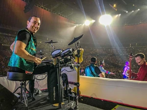 Pace playing drums during the  live tour.