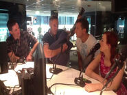 Anthony playing his blue Maton acoustic guitar on Triple M Network