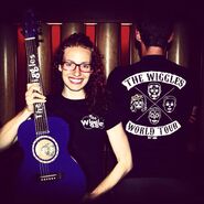 Emma with a New maton guitar and shirts for the tour