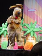 Wags dancing on stage at a show from the Wiggly Safari Tour.