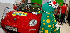Dorothy with the car at an auto show