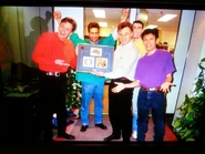 Crimson, white long sleeved polo shirt with turquoise polo shirt, yellow, bright purple