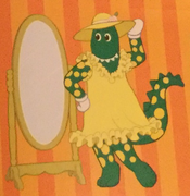 Dorothy in a yellow dress and hat (book/cartoon)