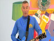 Anthony playing his blue Maton electric guitar in "Go Santa Go!"