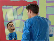 Anthony and a puppet of him looking in the mirror