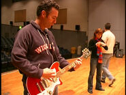 Anthony playing Murray's Red Maton Electric Guitar in A Wiggly Postcard from Asia