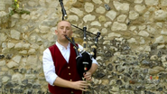 Douglas playing the bagpipes