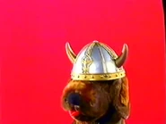 Puppet Wags' face covered in a viking hat