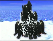 The little penguins destroying the snowman