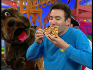 Anthony eating pizza