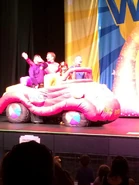 The Big Red Car in "Apples and Bananas Tour"