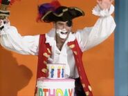 Captain Feathersword eating the birthday cake