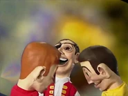 Puppet Greg and Murray bonking heads