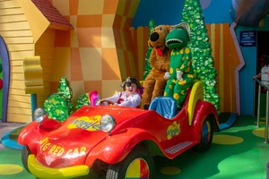 Michael King driving the Big Red Car with Wags and Dorothy in 2017