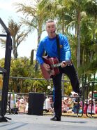 Anthony playing Murray's red Maton acoustic guitar at dreamworld