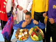 Anthony eating apple in "Hot Poppin' Popcorn"