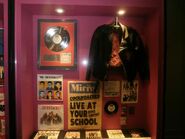 A collection of various band memorabilia on display at the Powerhouse Museum.