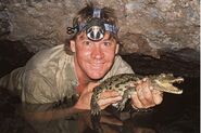 Steve Irwin holding a crocodile