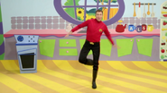 Simon dancing in his black rubber boots