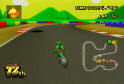 Yoshi nears an Oil Slick on his left in Mario Circuit 3.