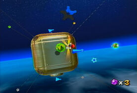 Mario uses a Spring Topman to bounce up to a blue Star Chip. This planet here is the Cube Planet covered in blue Star Chips.