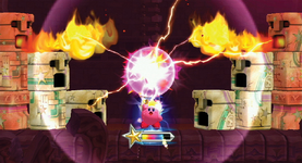 Kirby is in the miss of Flare Beam, and he is trying to destroy some statues, some of which are blowing out flames. This is in a stage in Raisin Ruins.