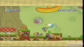 Kirby jumps while Prince Fluff uses his yarn whip to attack a Waddle Dee in Mushroom Run of Treat Land.