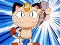 Meowth holding a Dragon Fang.