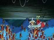 האנשובי צועקים "אוכל, אוכל, אוכל..." ומקפיצים את הסירה שבה נמצאים סקווידוויד ומר קראב