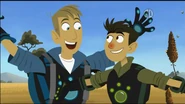 The Kratt brothers wave their arms in excitement.
