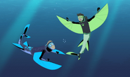 Chris and Martin in Flying Fish Power are swimming underwater.