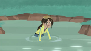 Aviva in the water with a mudskipper on her head