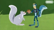 Martin in Gray Squirrel Power holding an acorn next to a gray squirrel