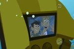The zealous Kratt brothers look out a broken window.