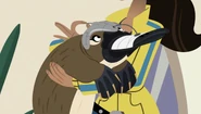 Aviva placing a helmet on Plato that will allow her to see how Plato navigates underwater, as well as record data for her