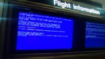 A Blue Screen of Death on a computer with flight information.
