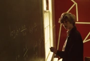 Bill Gates at a chalkboard during his youth