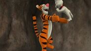 Tigger bounces with Buster.