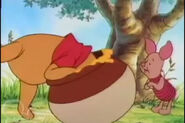 Winnie the Pooh is putting his head in a empty honey pot