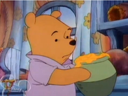 Winnie the Pooh and an empty eaten honey pot